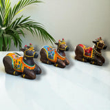 Hand-painted wooden Nandi cow idol in vibrant traditional attire