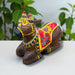 Handmade wooden Nandi cow idol with floral patterns, 7.5-inch sitting statue
