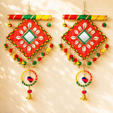 Wooden Rajasthani wall hanging tapestry in vibrant red green and yellow with central mirror and shell motifs for home decor