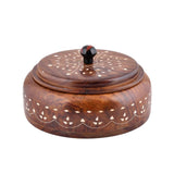 Round dark brown wooden spice jar with intricate white inlay lid and black knob for kitchen herbs and dry fruits storage