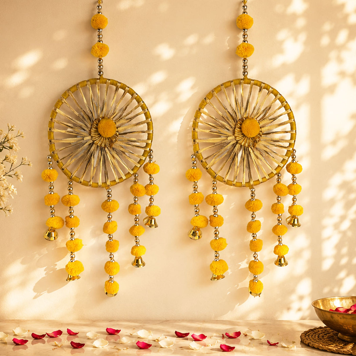 Golden circular woollen ring wall hanging with yellow pom-poms and small bells for traditional home decor