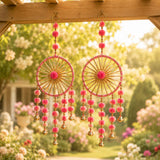Ring wall hanging woollen stuffed rajasthani dreamcatcher wind chimes with pink pom-poms and gold-toned bells for decor