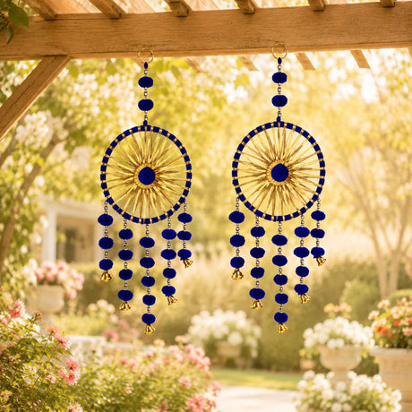 Blue and gold woollen stuffed traditional rajasthani dreamcatcher wind chimes hanging from wooden pergola decorative showpiece