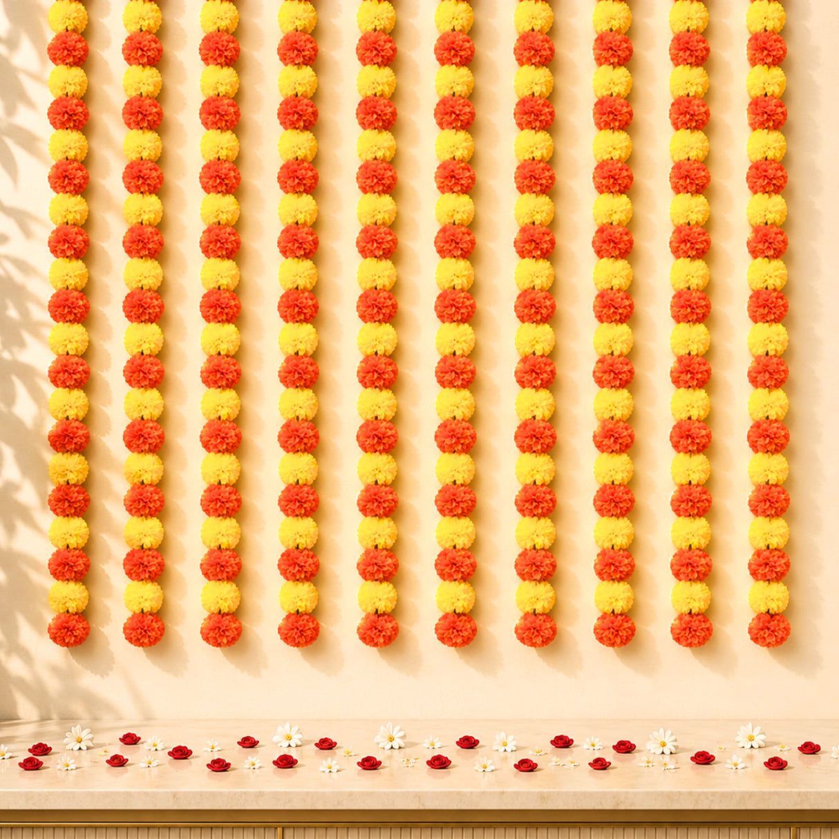 Artificial yellow orange marigold string garlands arranged in alternating vertical rows for Diwali and wedding decor